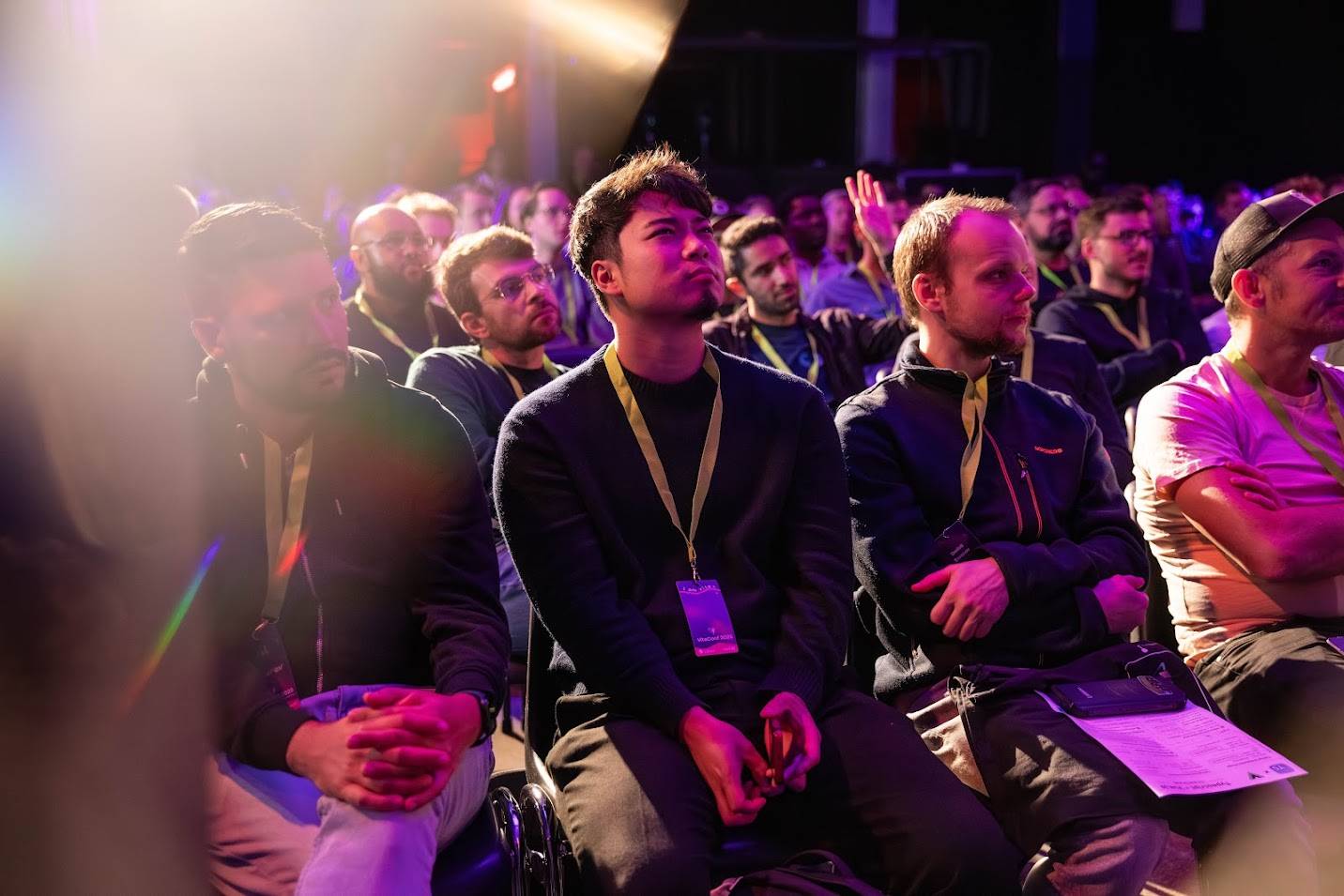 People in the audience looking up to the stage